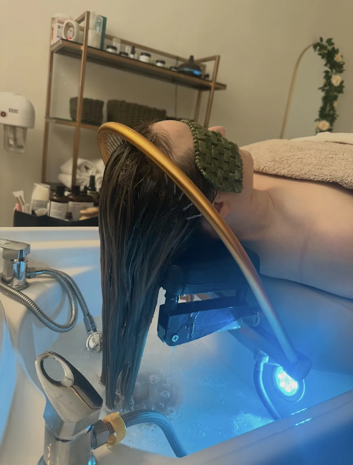 Scalp treatment close-up with a green headband